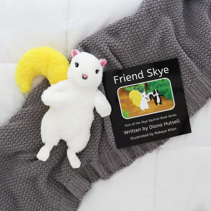 Friend Skye Book with Skye Squirrel with Yellow Stuffed Tail on a gray blanket