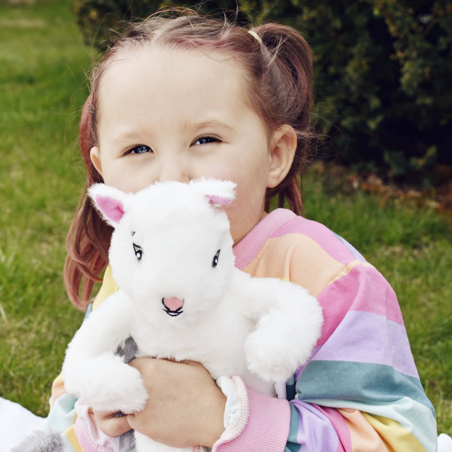 Little girl holding Skye Squirrel