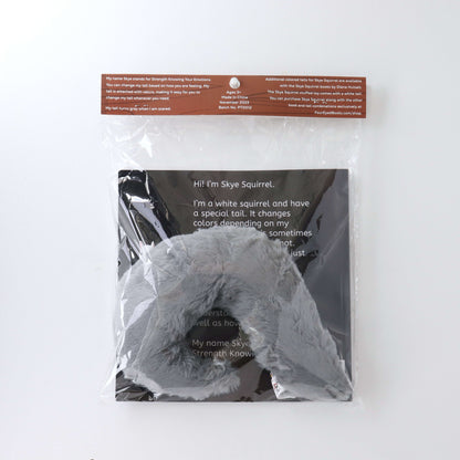 Gray Stuffed Tail in plastic packaging with book (back)